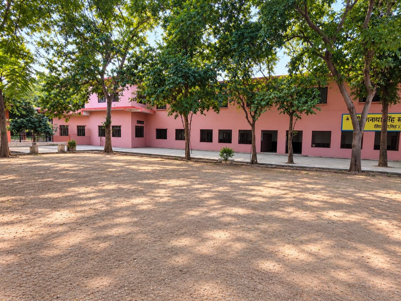 Pink academic building and campus grounds